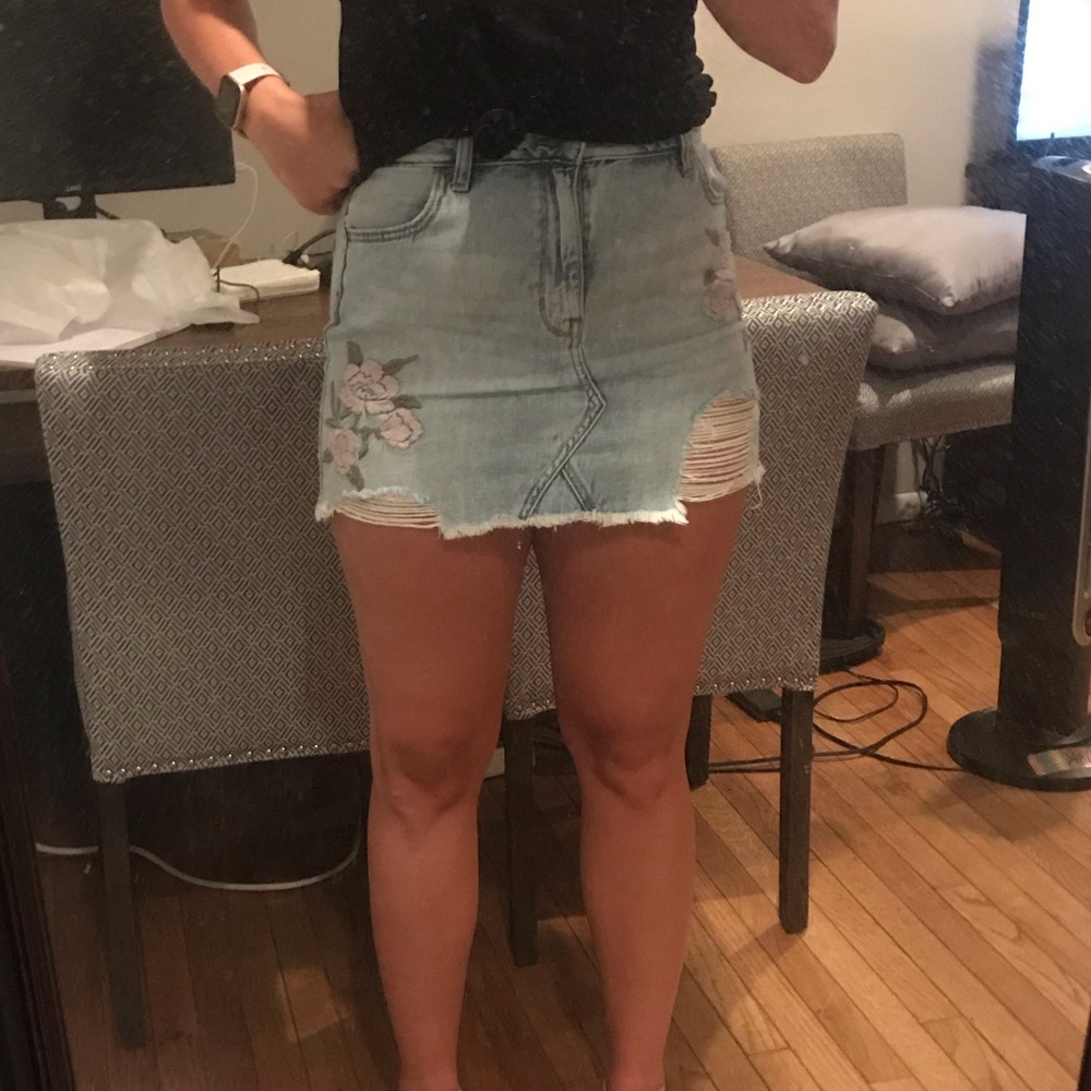 Light denim skirt with embroidery